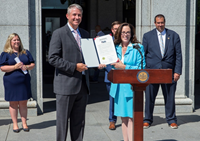 Dylan Lissette, CEO Utz Brands, Inc. accepts 100 Year Anniversary proclamation from York County Commissioner President Julie Wheeler. Source: Utz Brands, Inc.