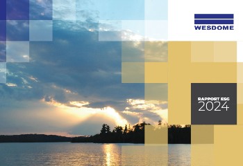 Wesdome employees wearing safety gear standing outside mill, with text “Growing Responsibly ESG Report 2020