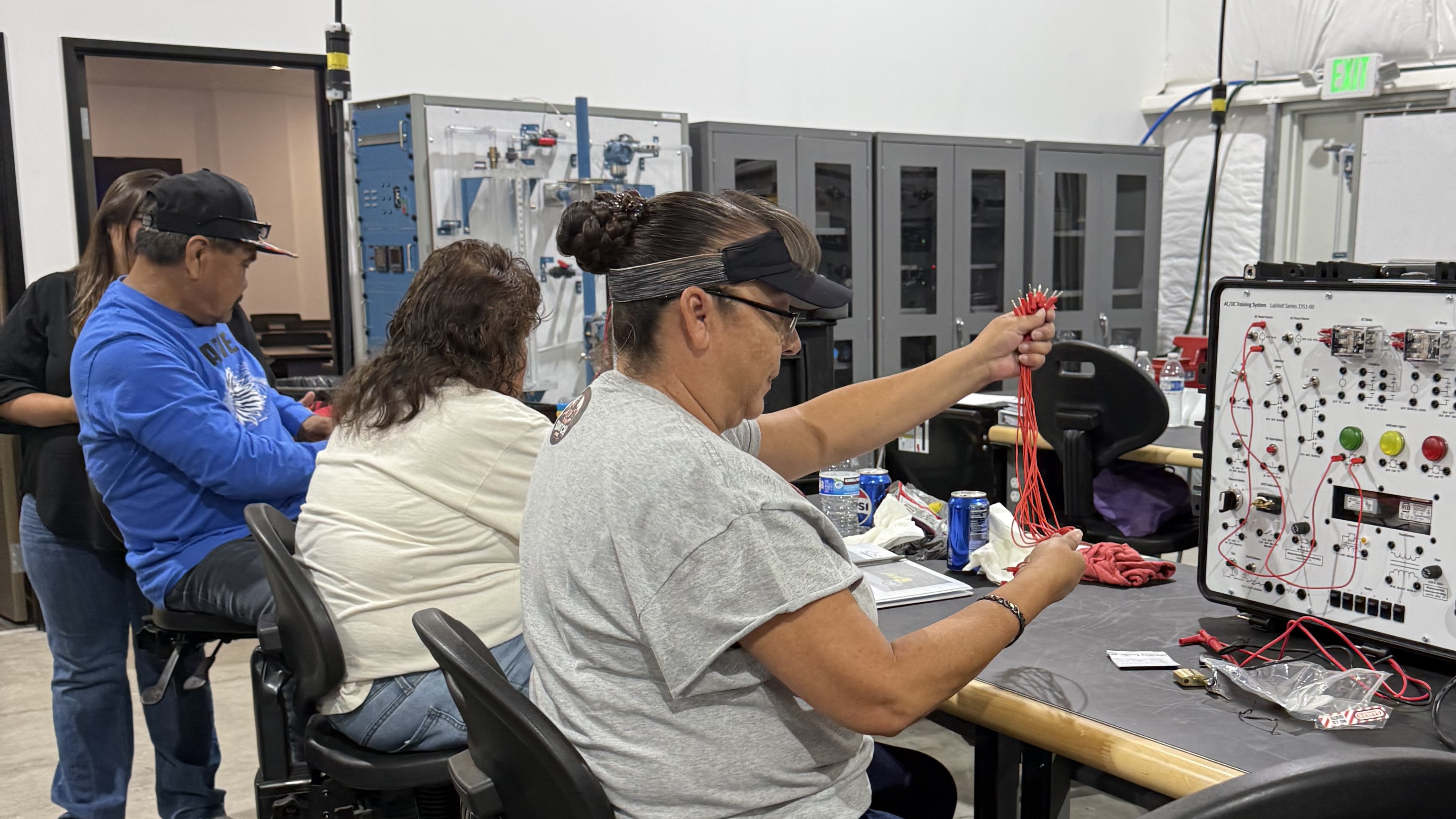 Training participants practicing electrical wiring